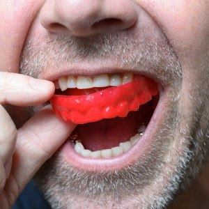 Man wears mouthguard