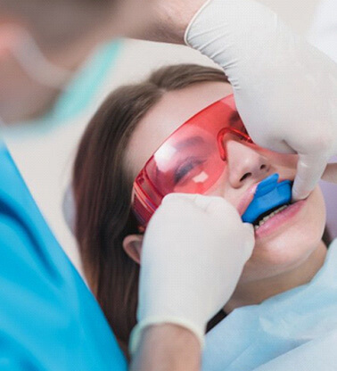a patient undergoing fluoride treatment for dental care