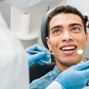 patient smiling while visiting dentist