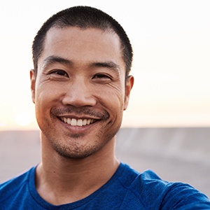 man smiling while taking selfie